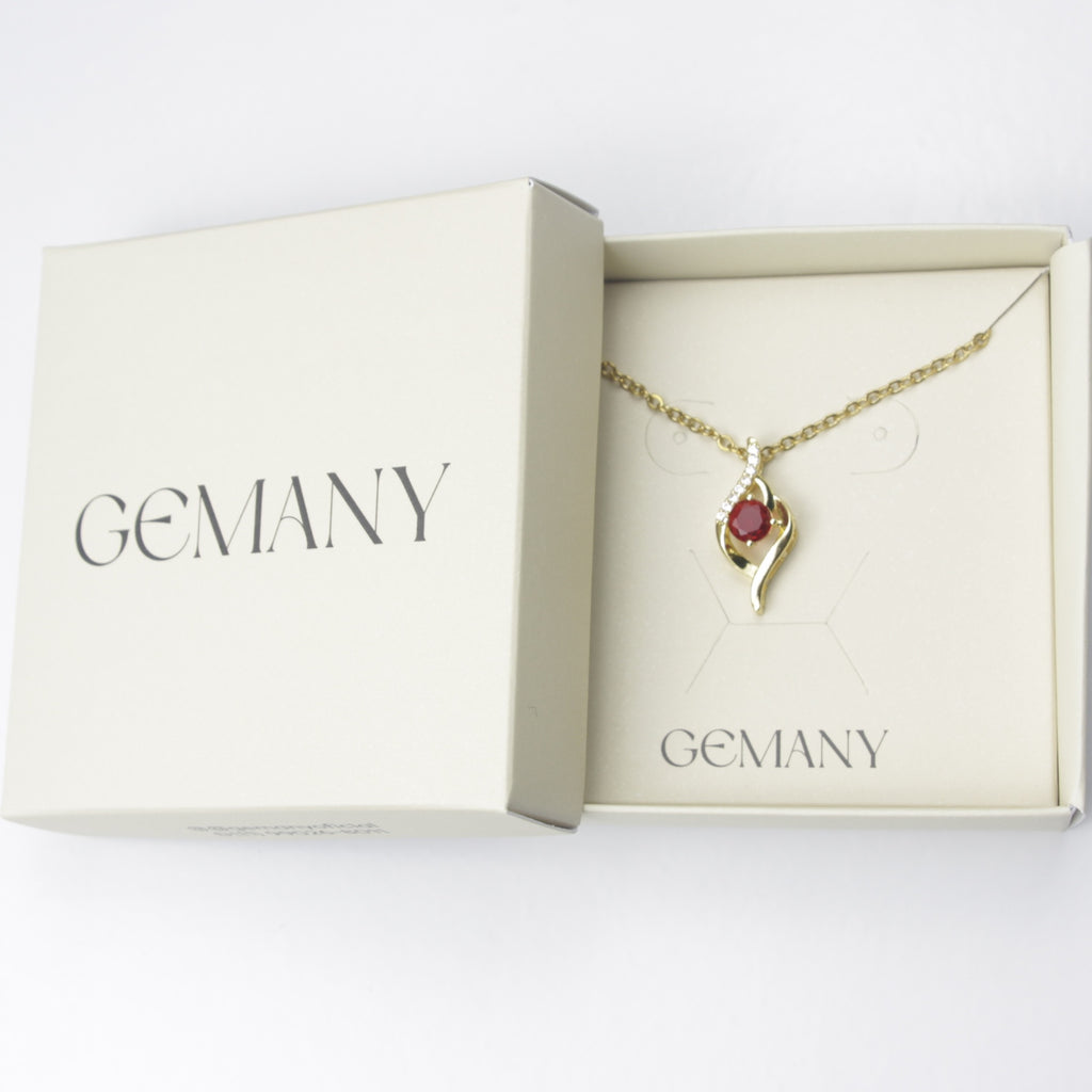 Caixa Gemany com colar Cristal Aurora dourado e cristal vermelho